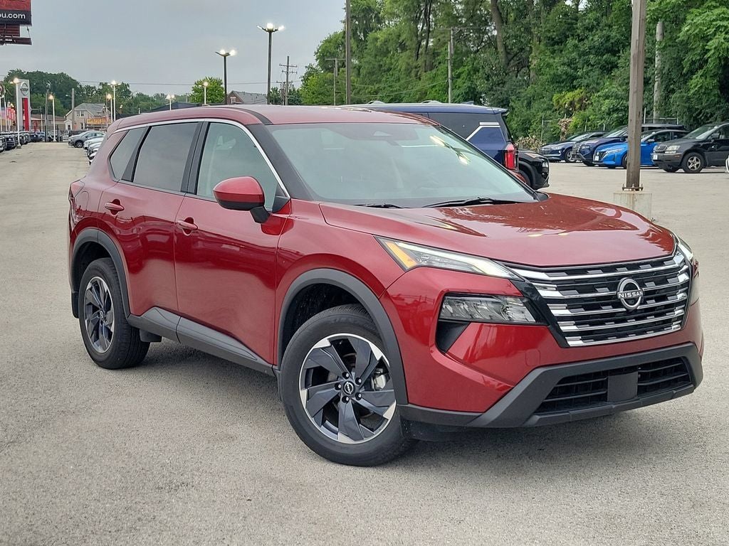 2025 Nissan Rogue SV in Scarlet Ember Tintcoat — front three-quarter view