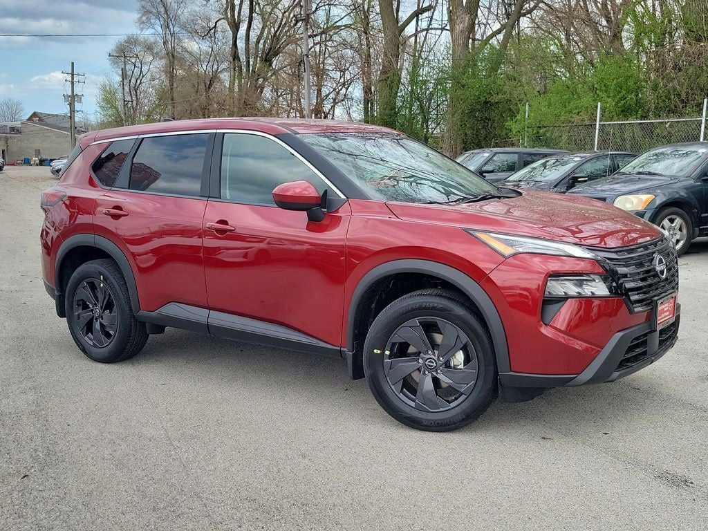 2026 Nissan Rogue SV in Scarlet Ember Tintcoat — front three-quarter view